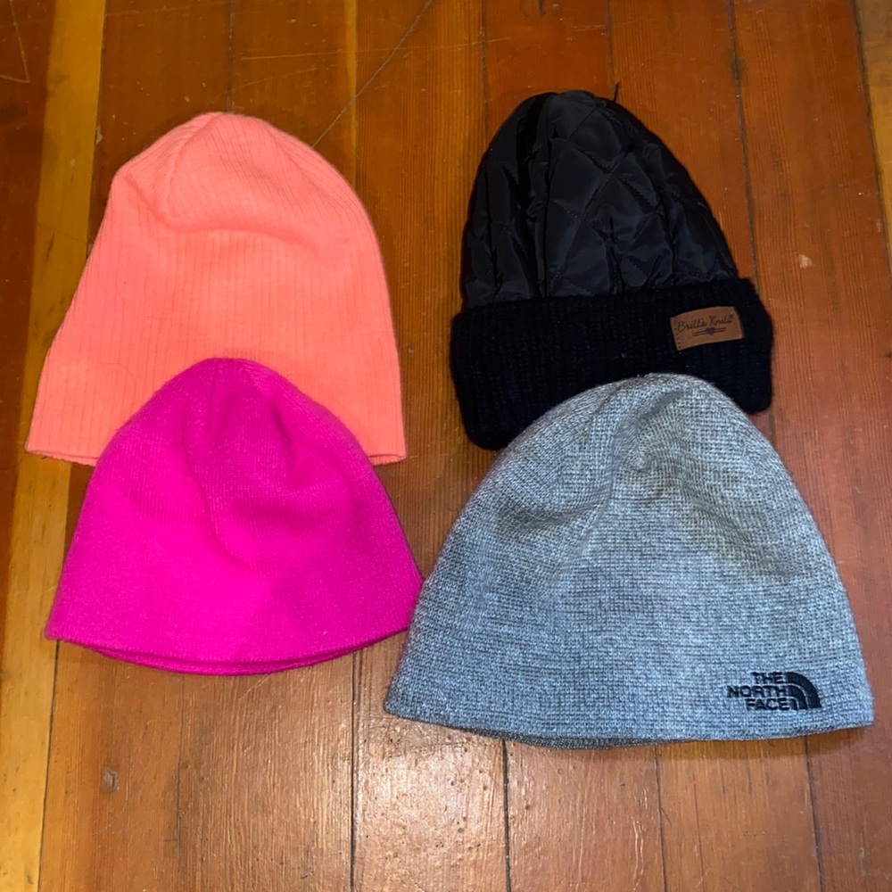 Lot of 4 hats. North face, Britt’s Knitts and 2 misc pink